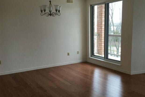 Westmount - living space with view to balcony & hardwood